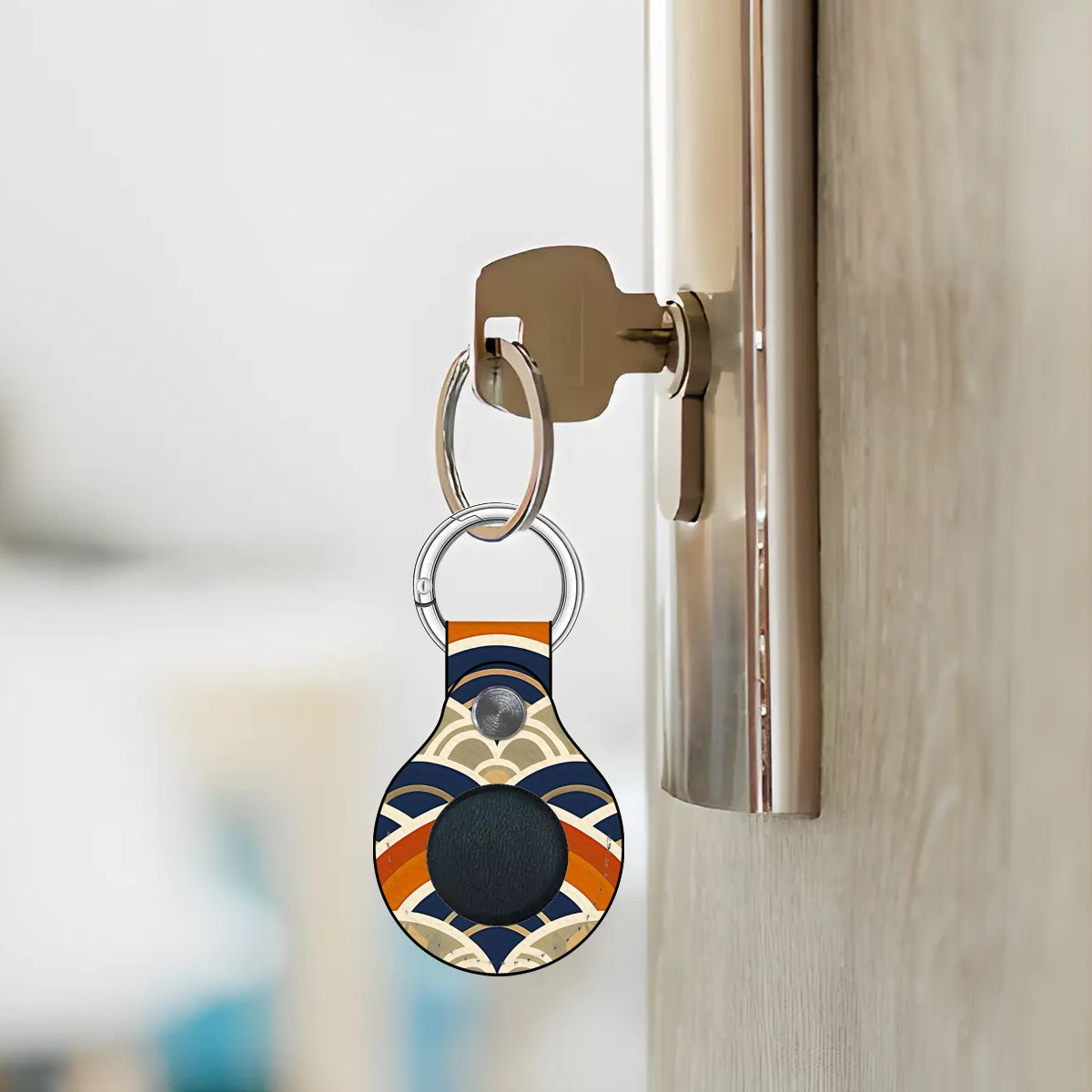 Keychain with a unique design attached to a door handle.