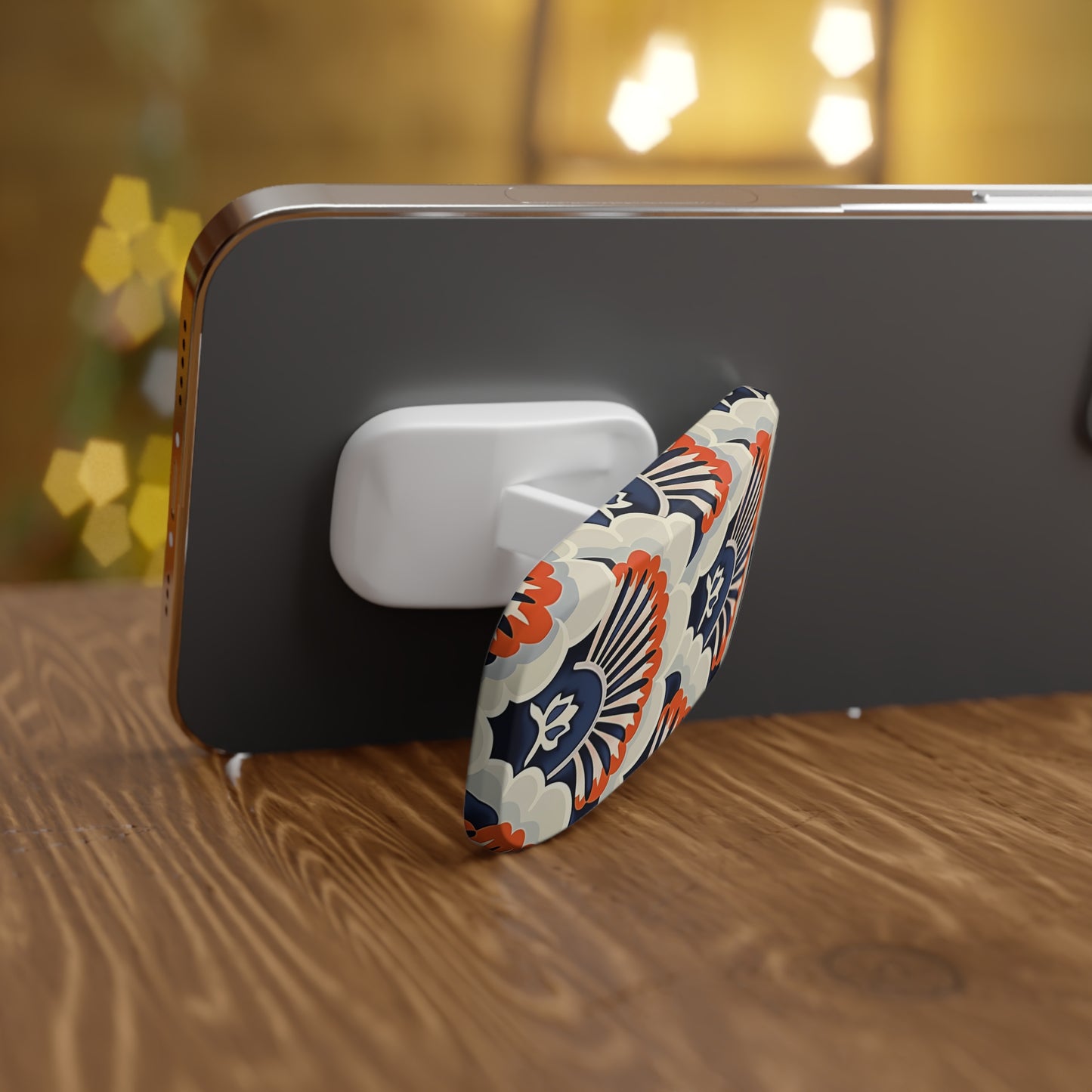Phone holder with floral design on a wooden surface