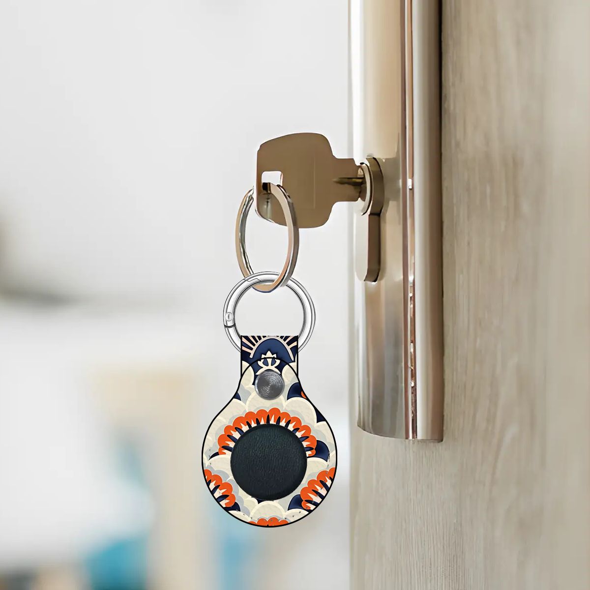 Keychain with a decorative design attached to a door handle.