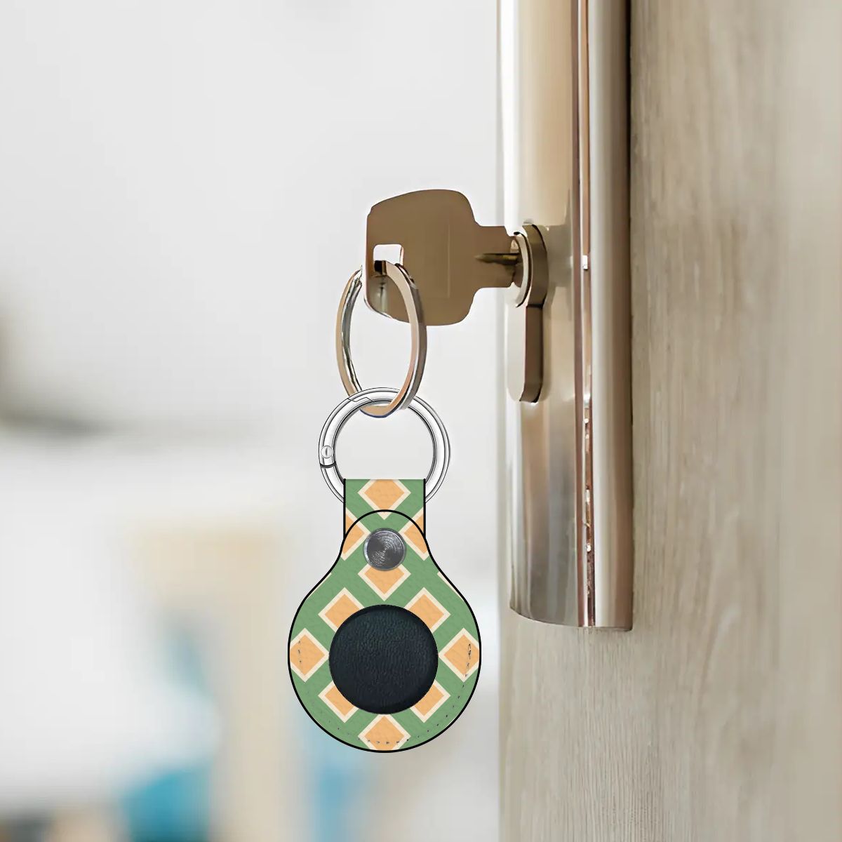 Smart keychain device attached to a door handle with a blurred background