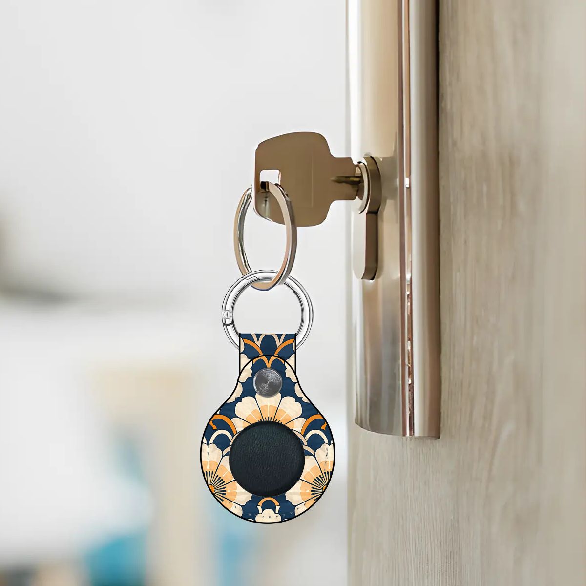 Keychain with a floral pattern attached to a doorknob.