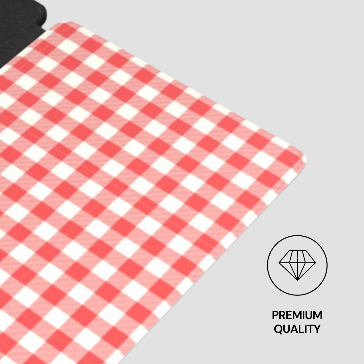 A close-up of a red and white gingham checkered fabric surface, shown diagonally on a light gray background with a small 'PREMIUM QUALITY' diamond icon in the lower right.