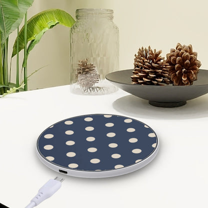 Blue polka dot charging pad on a white surface with decorative elements.