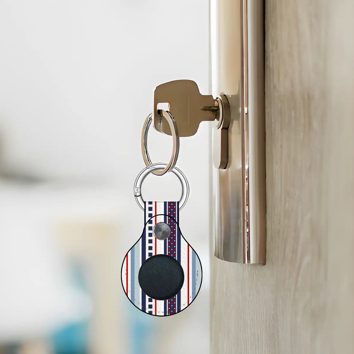 Keychain with a circular device attached to a door handle.