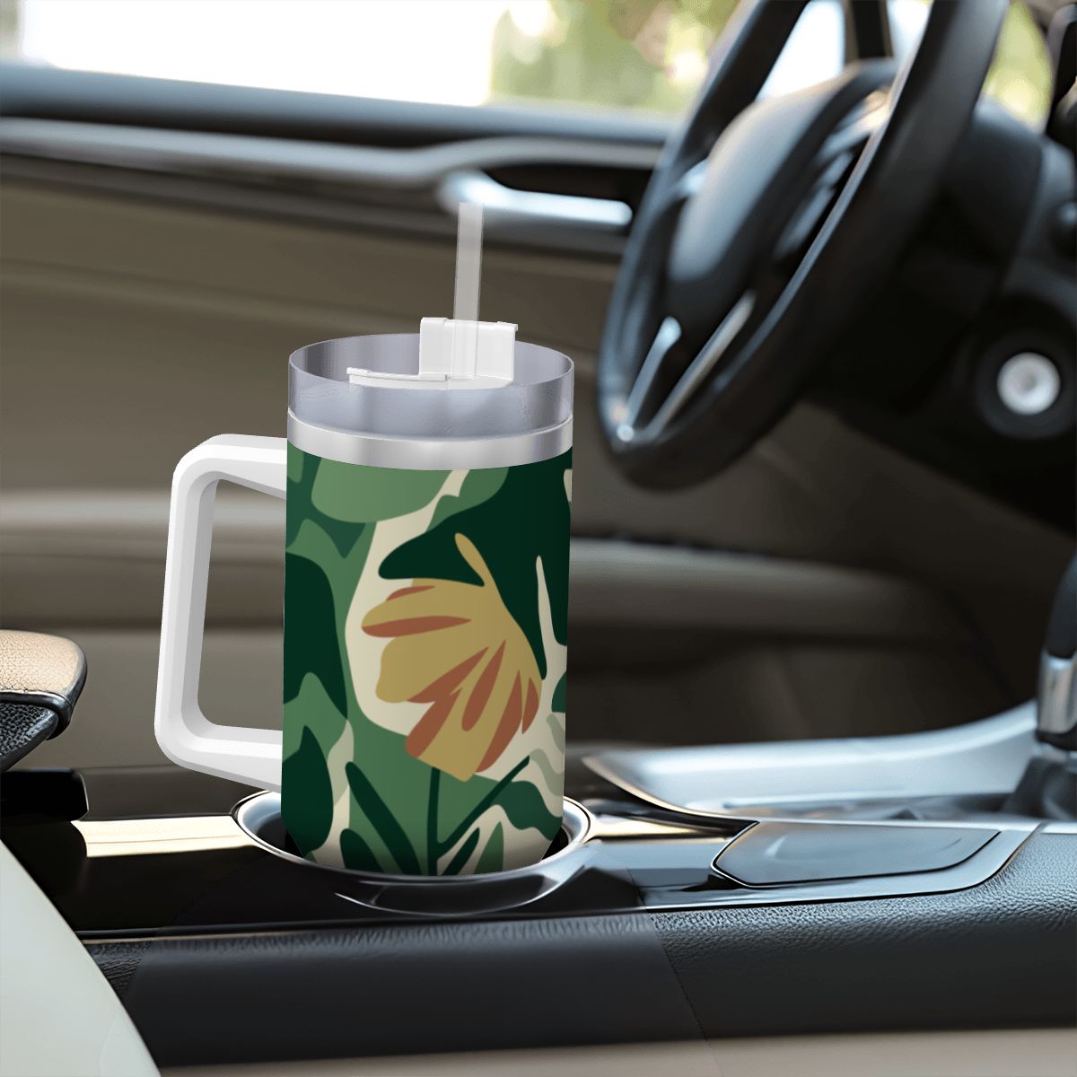 Tumbler with floral design on a car dashboard