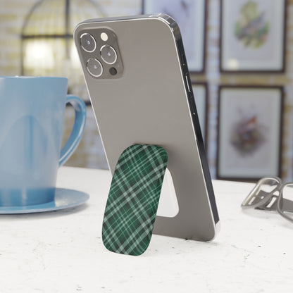 Phone with a green plaid stand on a table next to a blue mug. | Casenari