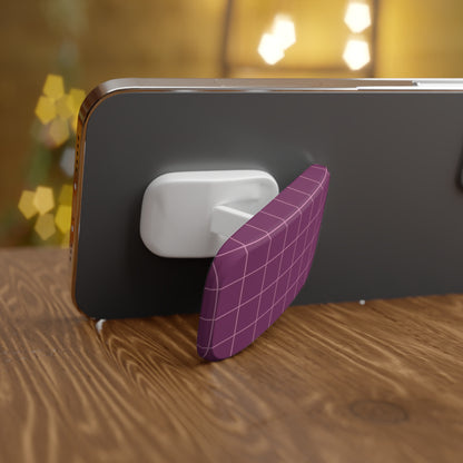 Phone with a purple grid-patterned stand on a wooden surface