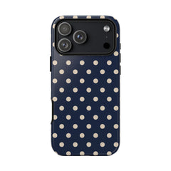 Phone case with a navy blue background and white polka dots on a white background