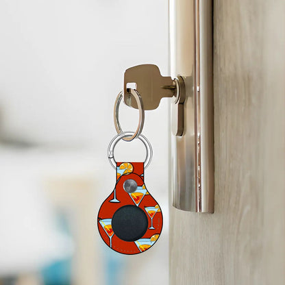 Keychain with a colorful design attached to a door handle.
