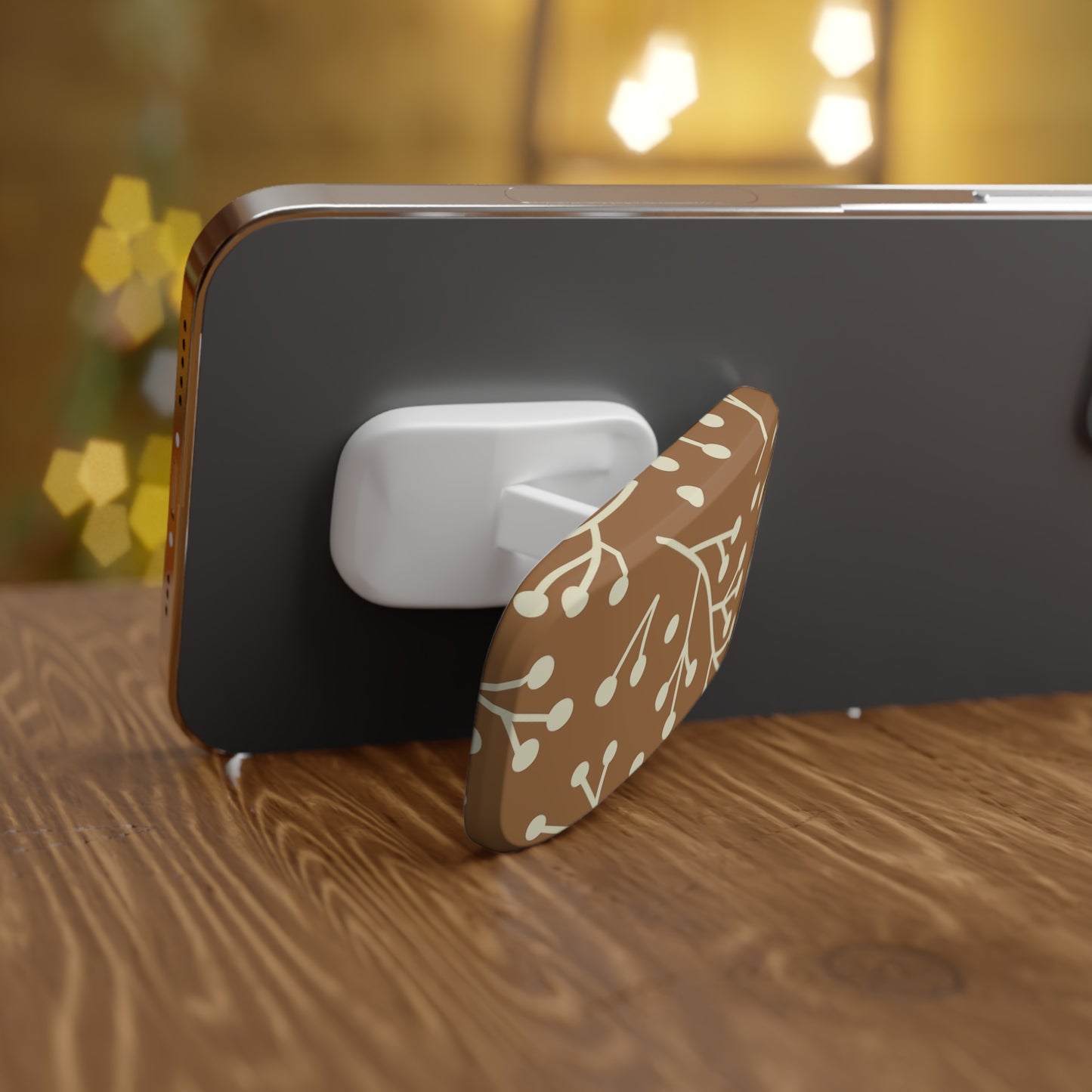 Phone with a floral design stand on a wooden surface