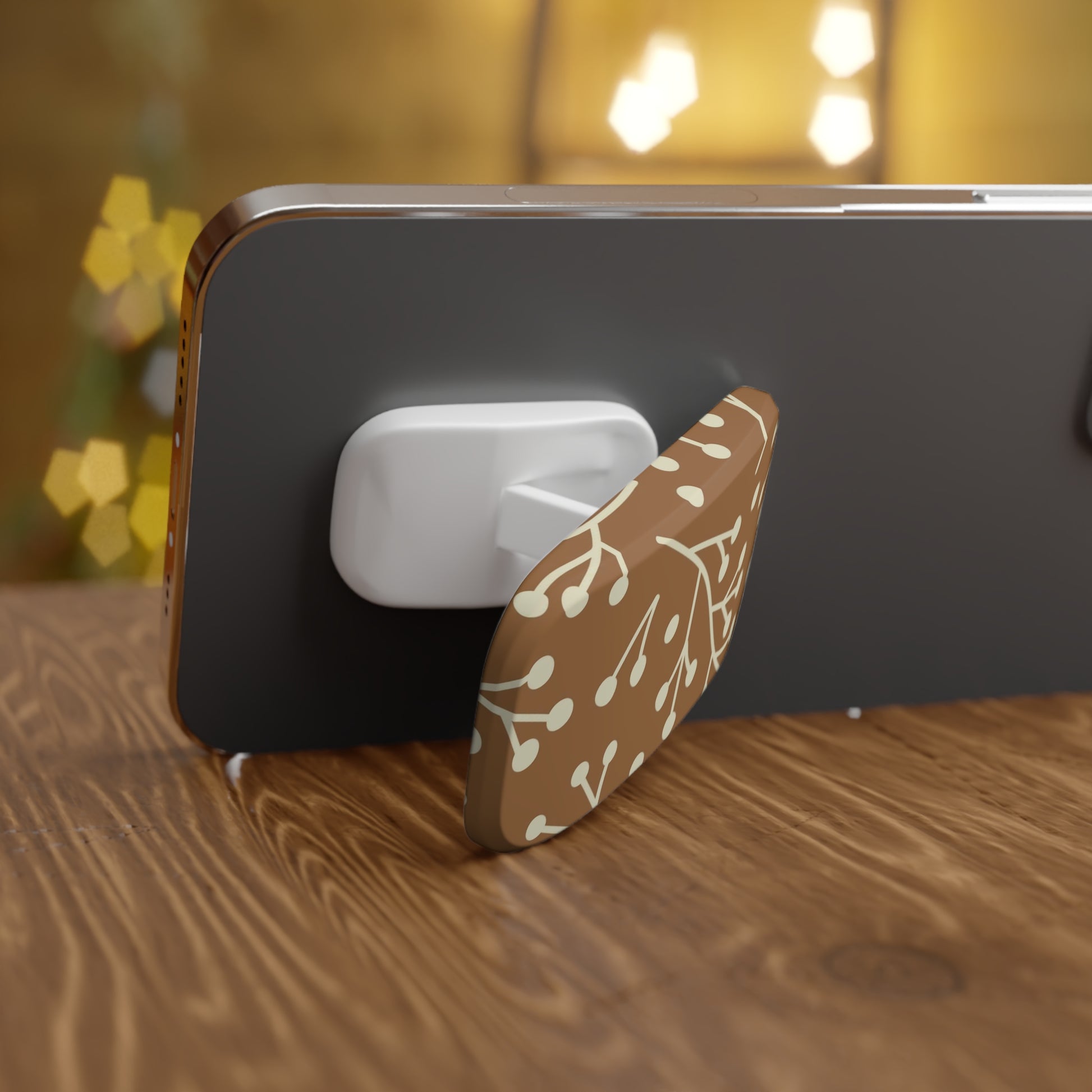 Phone with a floral design stand on a wooden surface
