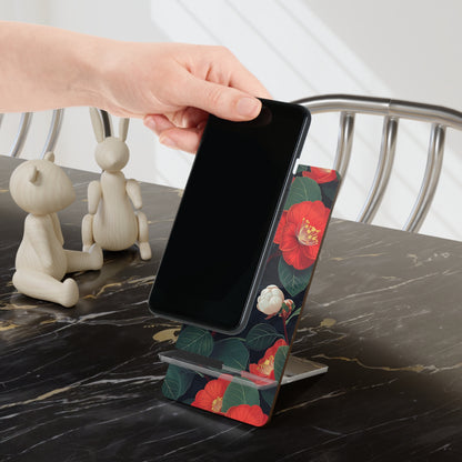 Phone on a floral stand being held by a hand on a marble surface with decorative items.