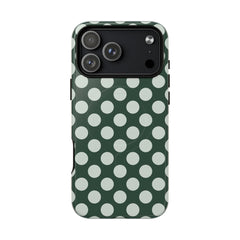 Phone case with green and white polka dot pattern on a white background