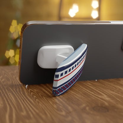 Phone with a decorative boat-shaped phone stand on a wooden surface