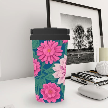 Floral-patterned tumbler on a desk with a framed picture in the background