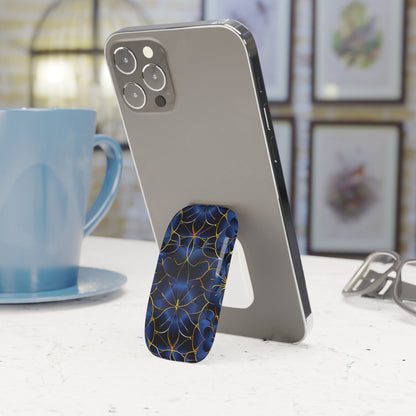 Phone case with blue and gold design on a white surface with a blurred background