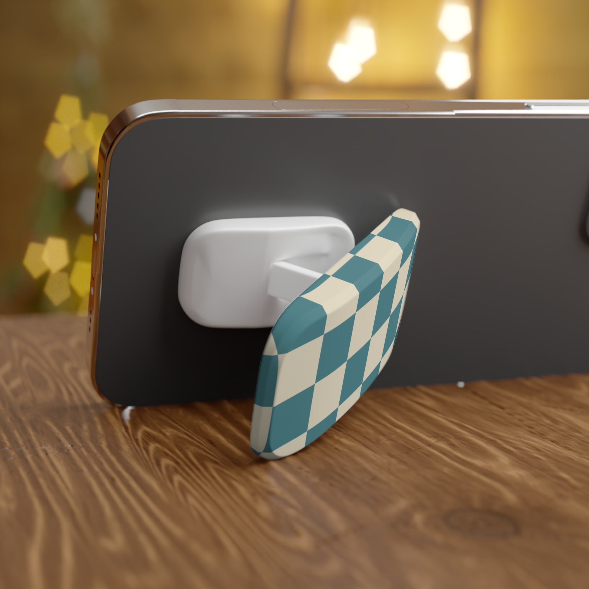 Phone holder with a checkered design on a wooden surface