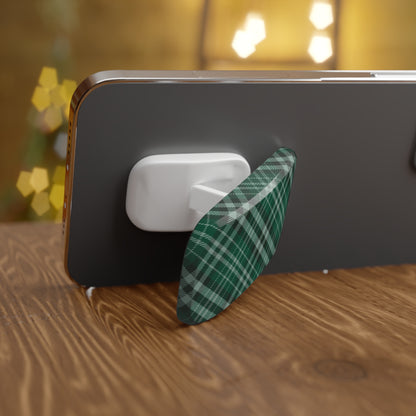 Phone with a green plaid case on a wooden surface with blurred lights in the background | Casenari