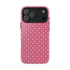 Phone case with pink and red circular pattern on a white background