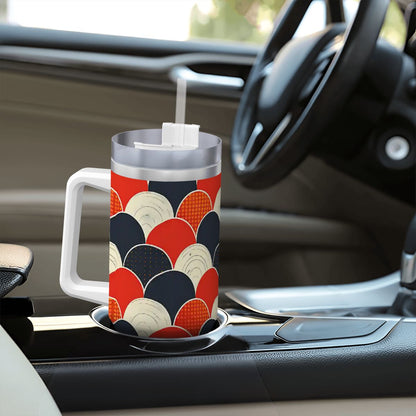 Colorful mug with geometric pattern on a car dashboard