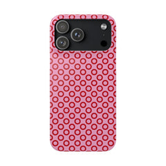 Phone case with red circular pattern on a pink background