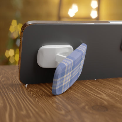 Phone with a blue and white checkered stand on a wooden surface