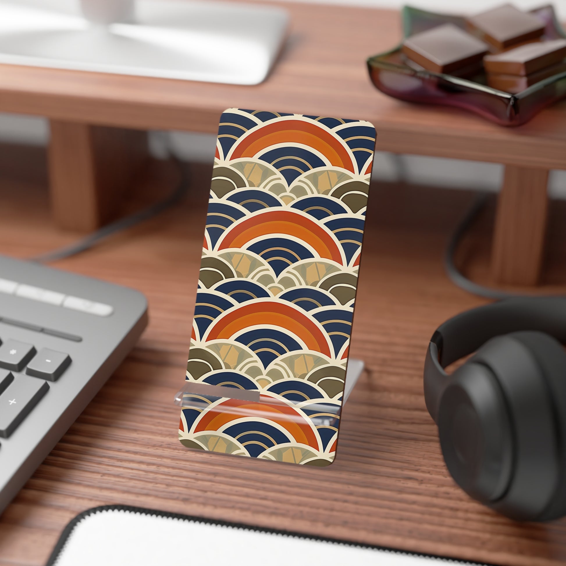 Phone case with wave pattern on a desk with keyboard and headphones