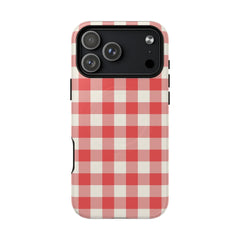 Phone case with red and white checkered pattern on a white background