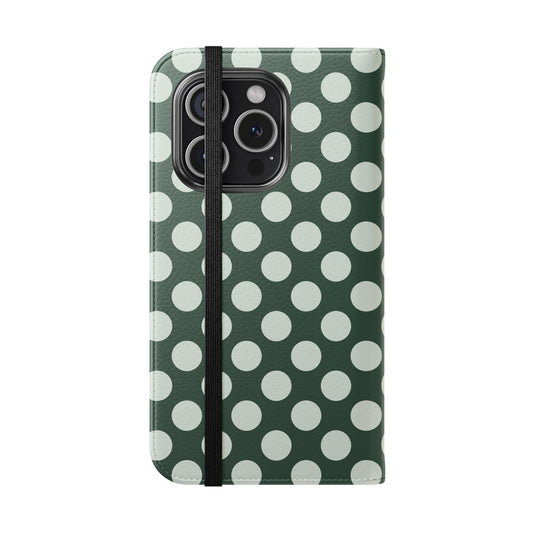 Phone case with green and white polka dot pattern on a white background