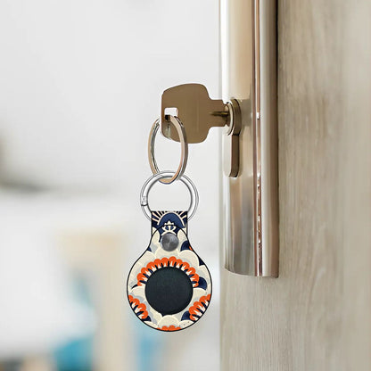 Keychain with a decorative design attached to a door handle.