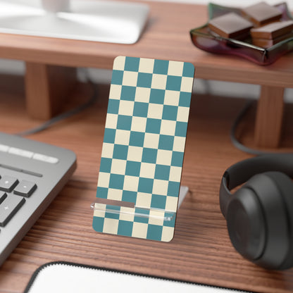 Checkered phone stand on a desk with keyboard, mouse, and headphones.