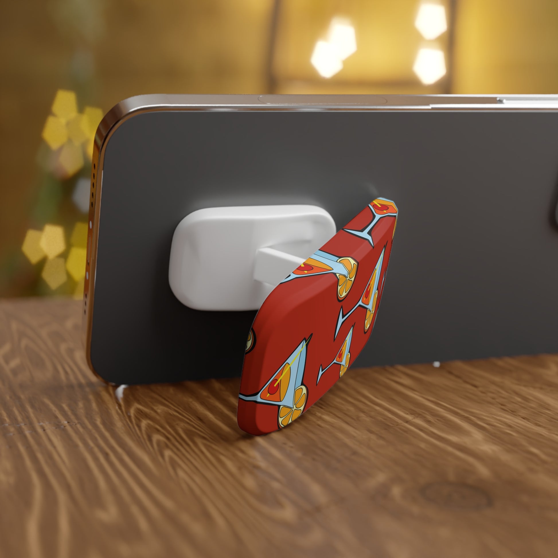 Phone with a colorful stand on a wooden surface with a blurred background