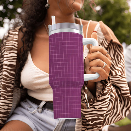 Person holding a purple insulated tumbler with a grid pattern