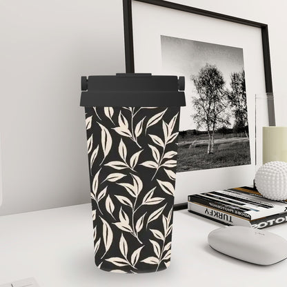 Black and white patterned can on a desk with a framed picture and books in the background