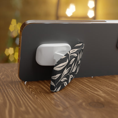Phone case with leaf pattern on a wooden surface