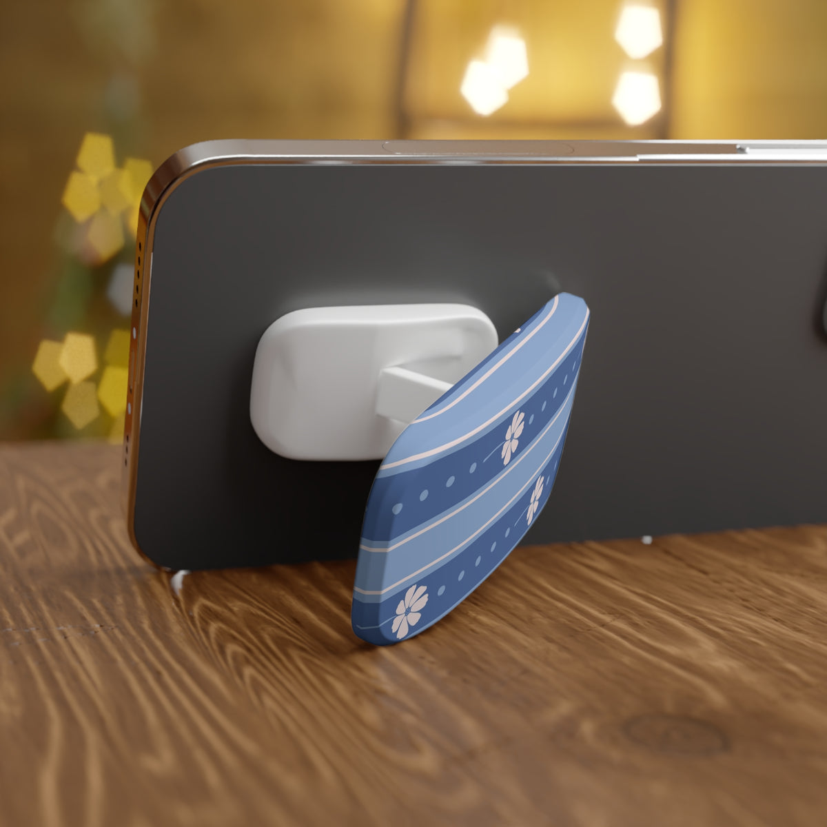 Phone case with a blue and white floral design on a wooden surface