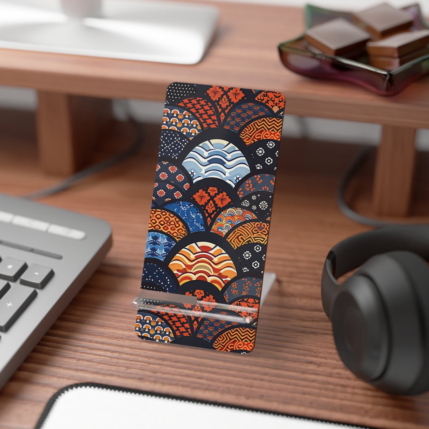 Colorful phone case with geometric pattern on a desk with keyboard and headphones | Casenari