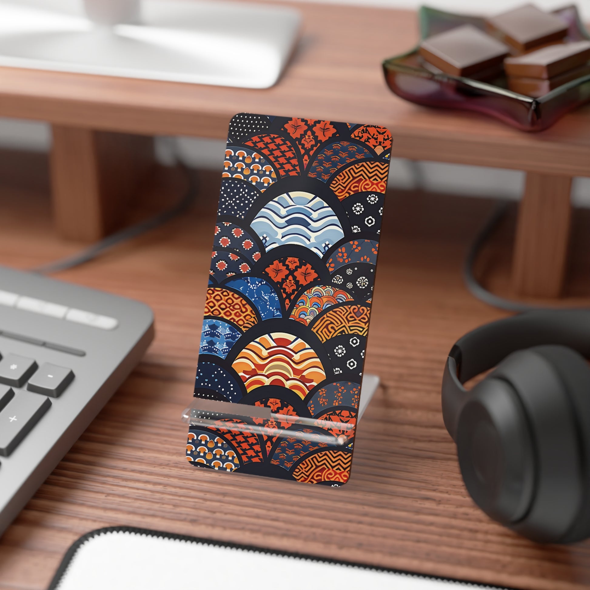 Colorful phone case with geometric pattern on a desk with keyboard and headphones | Casenari