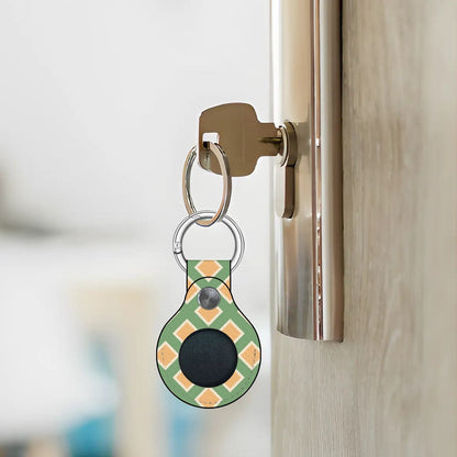 Smart keychain device attached to a door handle with a blurred background