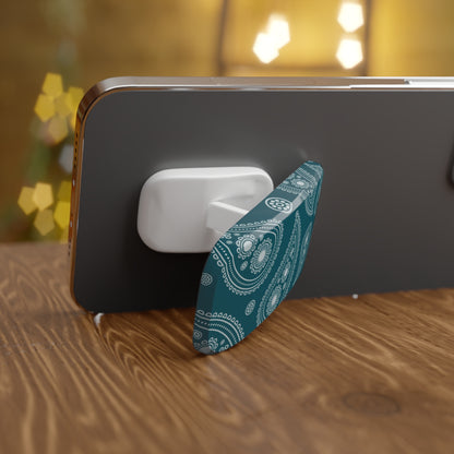 Phone with a blue and white patterned stand on a wooden surface