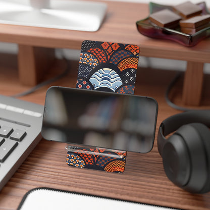Phone stand with decorative card on a desk with keyboard, mouse, and headphones. | Casenari