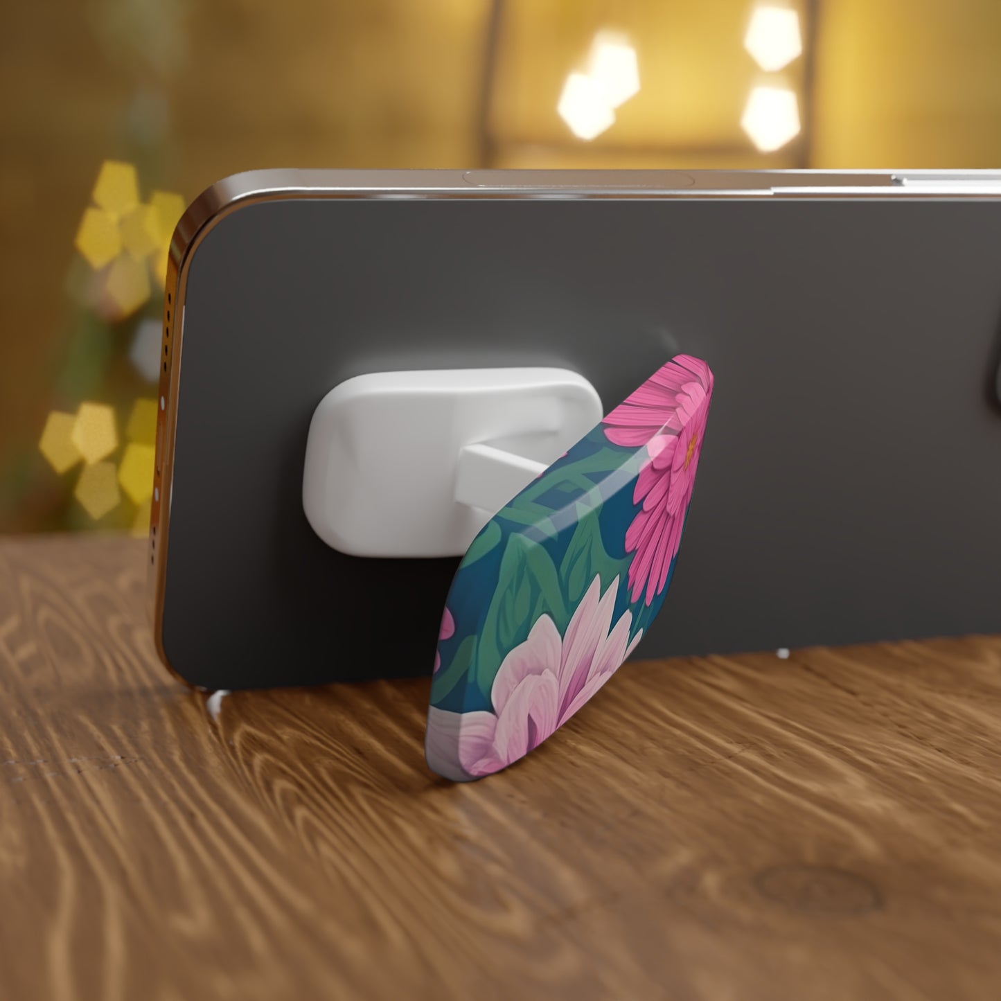Phone with a floral design phone holder on a wooden surface