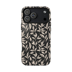 Phone case with leaf pattern on a black background