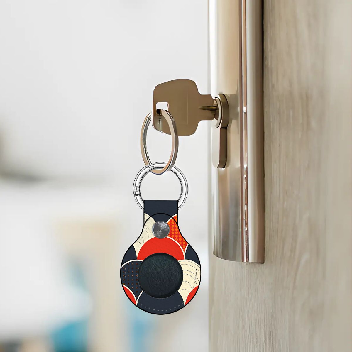 Colorful keychain attached to a doorknob with a blurred background