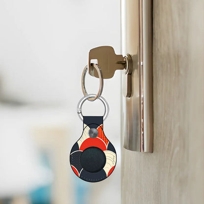 Colorful keychain attached to a doorknob with a blurred background