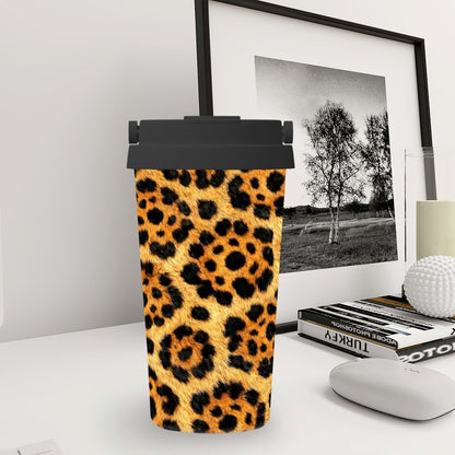 Leopard print tumbler on a desk with a framed picture and books in the background