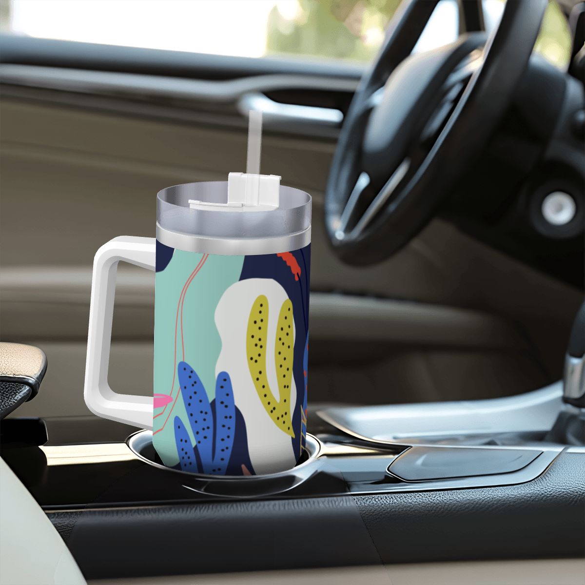 Colorful mug with a floral design on a car dashboard