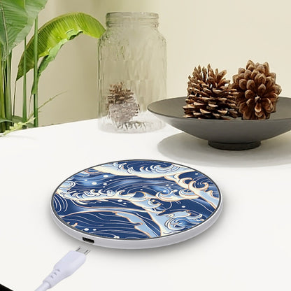 Wireless charging pad with blue wave design on a white surface with decorative items | Casenari