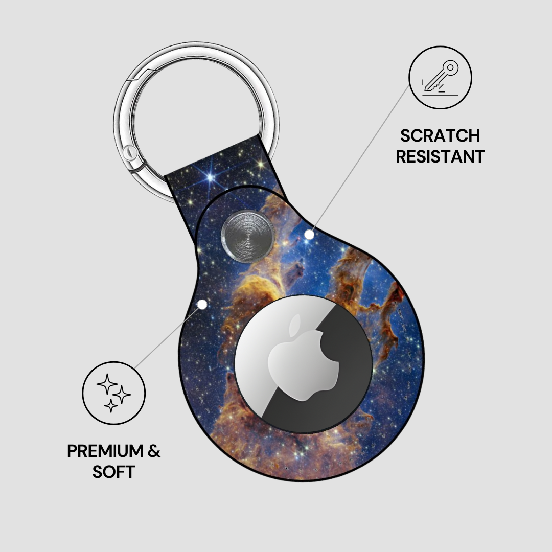 Keychain with space-themed design featuring a brand logo, labeled as scratch-resistant and premium & soft.
