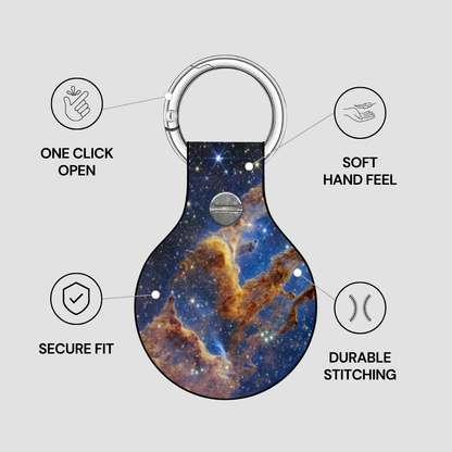 Keychain with space-themed design on a gray background